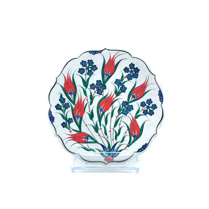 Iznik plate flowers rising around coral red tulips