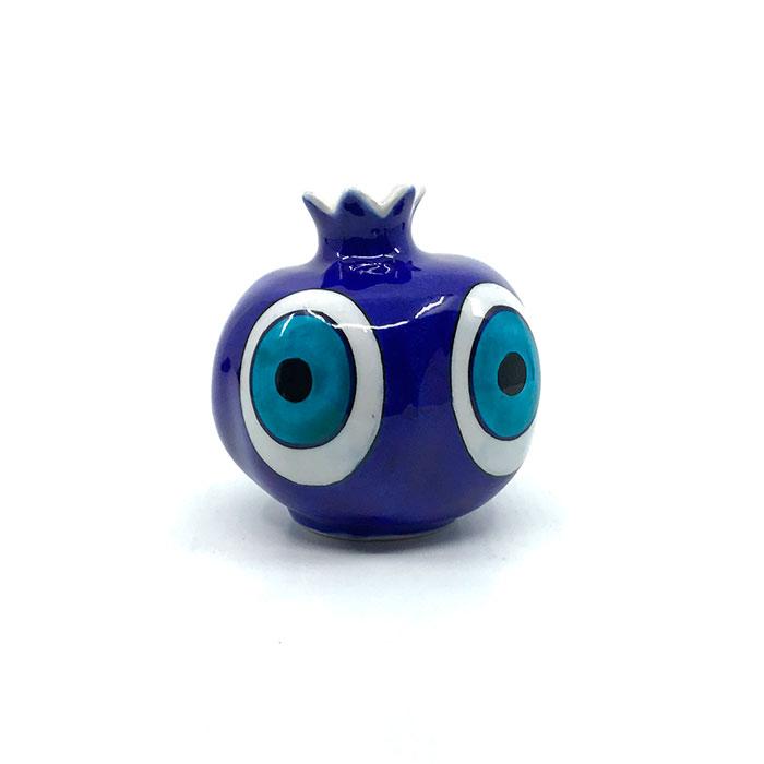 Evil eye design depicted on turkish ceramic pomegranate